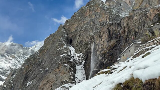 The majestic Vasudhara Waterfall in a snowy Himalayan landscape 4k.