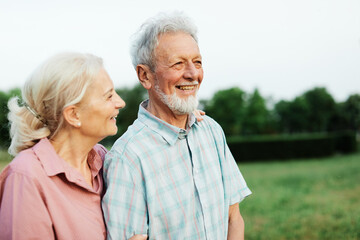 Happy active senior couple having fun outdoors. Portrait of an elderly couple together