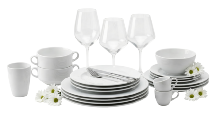 Elegant white porcelain dinnerware set and wine glasses arranged with delicate floral accents