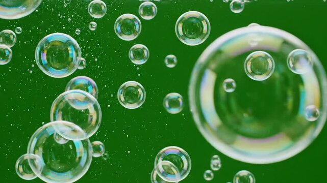 Glowing orbs suspended in green screen with bubbles shimmering as they float effect green screen rising bubbles style featuring