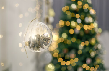 Decorated Christmas tree with garland lights bokeh background