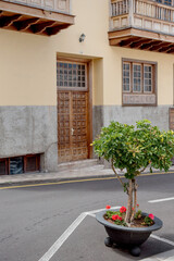 Garachico, Tenerife, Spain: A beautifully detailed building with wooden accents and classic architecture on a quiet street