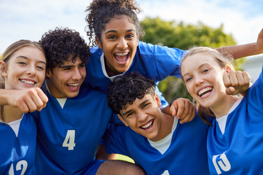 Soccer team celebrating victory during a championship