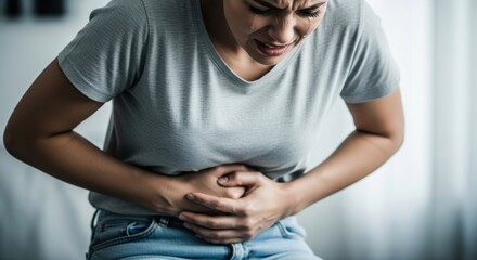 Woman experiencing severe stomach pain and discomfort
