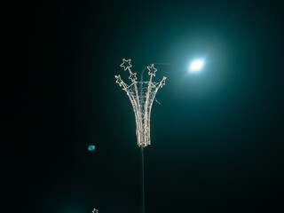 Festive Street Light Decoration with Star Lights at Night, Minimal Dark Background and Urban Holiday Mood