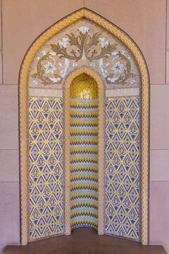 View of ornately designed niche with gold and blue geometric patterns and floral accents creates an enchanting visual, Muscat, Muscat Governorate, Oman.