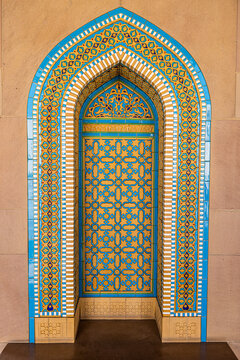 View of a beautifully tiled archway with intricate geometric patterns and bright colors, a testament to Islamic artistry, Muscat, Muscat Governorate, Oman.