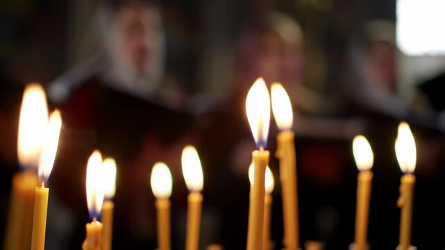 Candles burning softly in a church setting, with a choir singing in the background. Concept of spirituality, worship, and community gatherings.