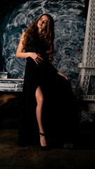 The girl in a delicate black dress near the tower of the elf.