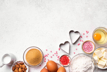 Valentine day baking background with heart shaped cookie cutters