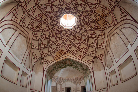 View of geometric patterns and light streaming through an octagonal skylight in the interior of a building, Lahore, Punjab, Pakistan.