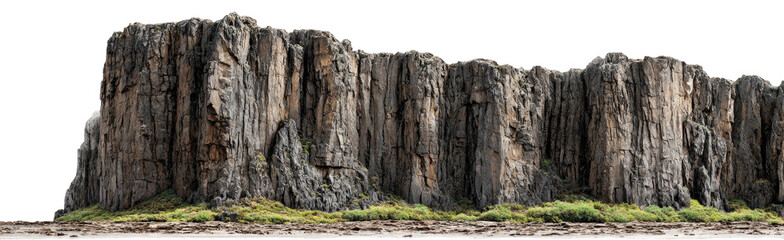 Obraz premium A tall, rocky cliff face with vertical striations, minimal vegetation at base, isolated on black