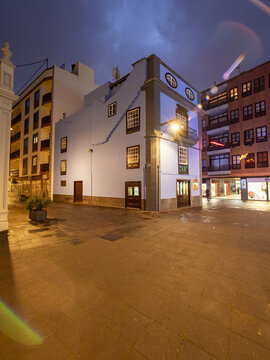 San Cristobal de La Laguna, Spain - 17 December 2016: View of the historic buildings bathed in warm light against a backdrop of the twilight sky.