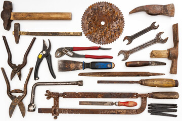 Flat lay of old hand tools on white background. Large collection of various rusty tools and bits...