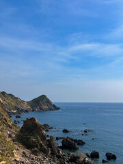 Green Rocky Mountain Beside the Ocean