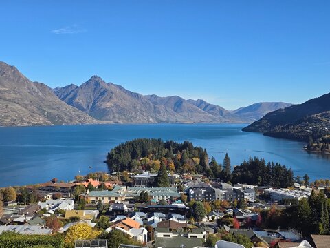 A City from Above along a Lake Surrounded by Mountains