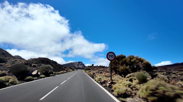 Panoramic view from a moving car of the Teide National Park. The road leading to the Teide volcano, Tenerife, Canary Islands, Spain