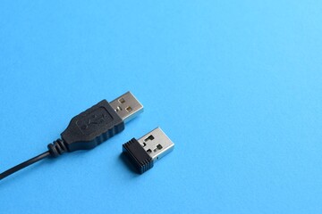Wireless and wired USB cable on a blue background