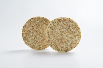 Two round buckwheat crispbreads close-up on a light background