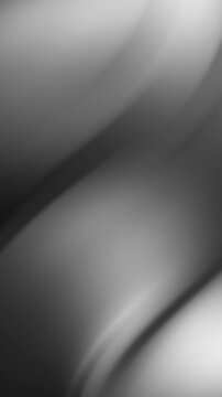 Abstract blurry gray pattern with subtle curves, perfect for background design in modern graphic projects or web layouts.