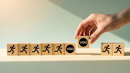 Hand placing final block with yes on running man blocks in a row on a table with green background