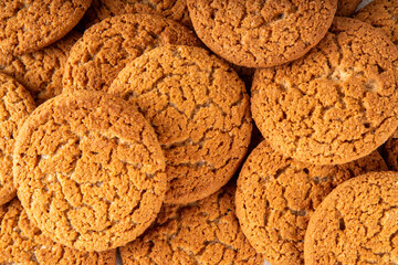 Homemade golden-brown Gingersnap Cookies stack on kitchen table. Traditional american ginger snap...