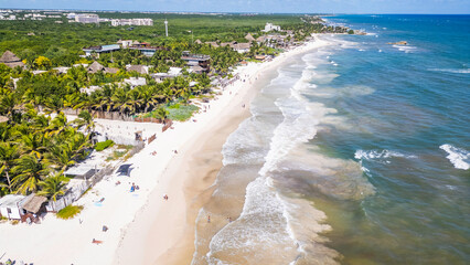 Tulum Beach, Quintana Roo, Mexico, Beach with a lot of people and a beautiful ocean. The beach is crowded with people enjoying the sun and the water