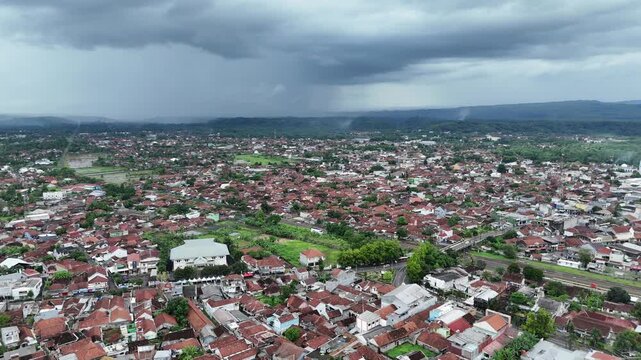 Drone footage of residential areas with a hilly background in Banjar City, West Java, Indonesia