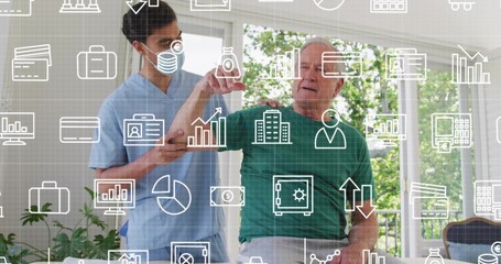 Supporting caregiver in blue scrubs and mask guiding senior raising arm at home with overlay icons