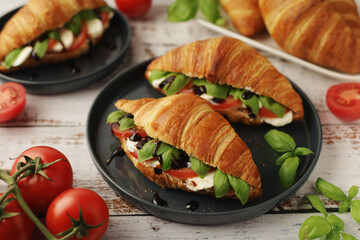 Croissants with mozarella cheese and tomatoes in caprese style
