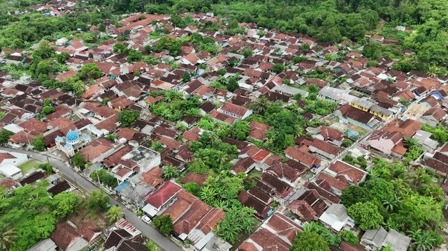Drone footage of residential areas with a hilly background in Banjar City, West Java, Indonesia