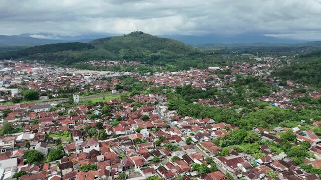 Drone footage of residential areas with a hilly background in Banjar City, West Java, Indonesia