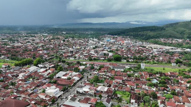 Drone footage of residential areas with a hilly background in Banjar City, West Java, Indonesia