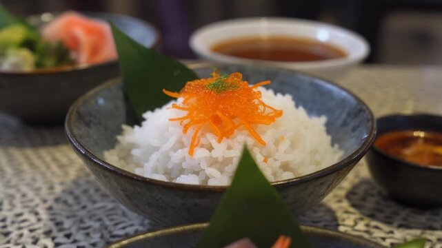 Mix sashimi and ebi served with Japanese cooked rice on table. Clean food concept. Focus shift and movement camera.