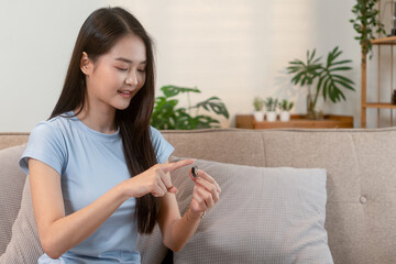 Woman showing health-monitoring smart ring at home