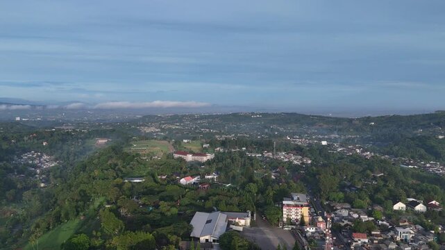 Drone footage of residential areas, villas and hills in Cisarua, West Java, Indonesia