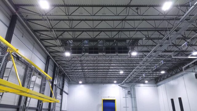 Air conditioning fan vents mounted on steel ceiling of cold storage warehouse	
