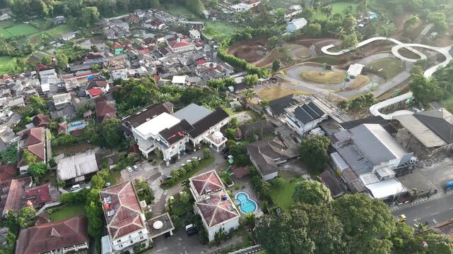 Drone footage of residential areas, villas and hills in Cisarua, West Java, Indonesia