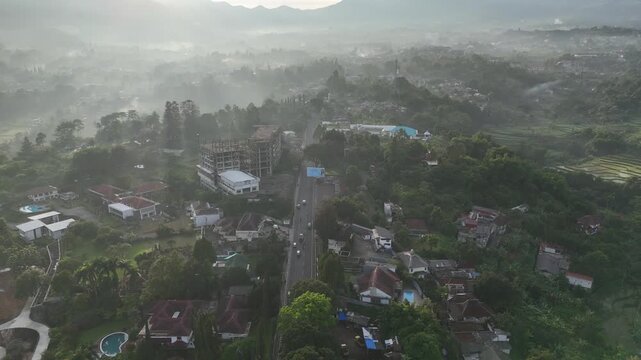 Drone footage of residential areas, villas and hills in Cisarua, West Java, Indonesia