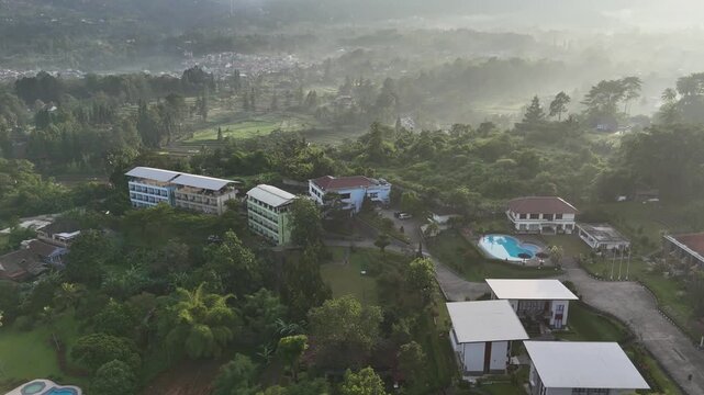 Drone footage of residential areas, villas and hills in Cisarua, West Java, Indonesia
