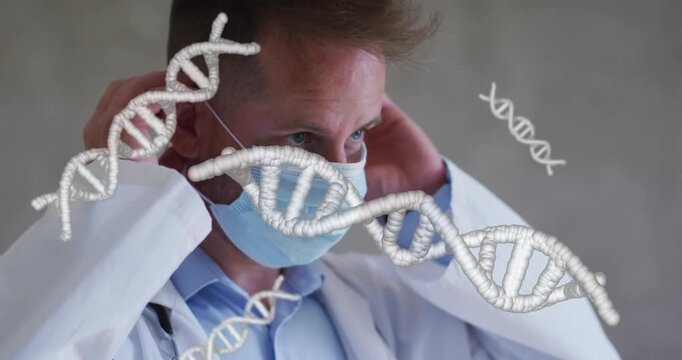 Doctor donning surgical mask, molding nose for exam while DNA helix floating across face