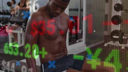 Shirtless man lifting weight and completing reps for form in gym with finance tickers overlaid