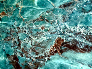 Close up of turquoise marble texture with brown veins and natural patterns for background