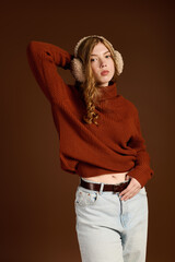 Elegant redhead showcases cozy winter fashion in studio setting