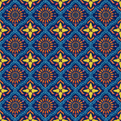 Vibrant Seamless Mediterranean Tile Pattern with Yellow, Pink, and Orange Floral Motifs on a Rich Indigo Canvas Texture.