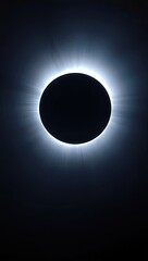 A total solar eclipse shows a dark circular moon with a bright corona