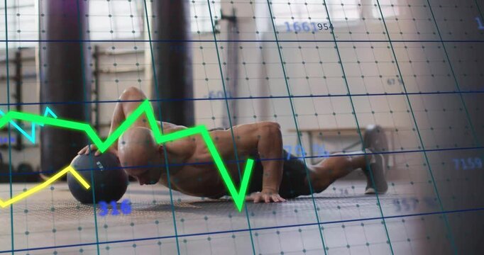 Man lowering into pushup on ball in fitness reaching while graphs moving in sync building strength