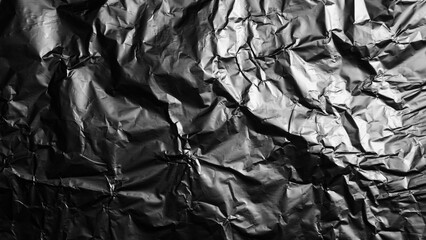 Silver metallic crumpled aluminum foil background