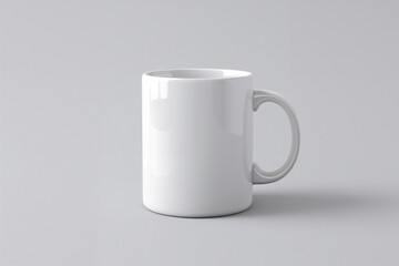 White Ceramic Mug with Handle on a Light Gray Background