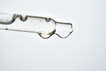 Pipette tip dispensing transparent cosmetic serum drops